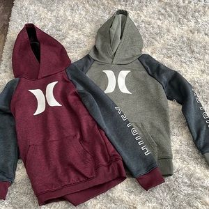 Two Hurley sweaters